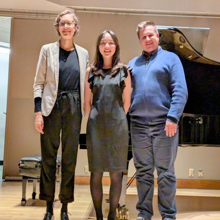 Cecilia Kim (centre) with conductors Emanuelle Lambert-Lemoine (left) and Travis Mandel (right)